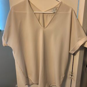 Cream colored sheer blouse